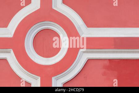 Red and white geometric wall decoration, close up photo background with vintage architecture details Stock Photo