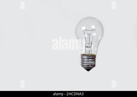 Light bulb on a gray background, banner with space for text Stock Photo