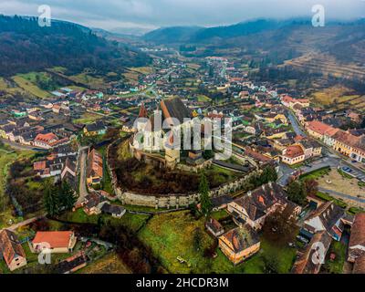 Drone view of the medieval Saxon village of Biertan and his fortified church. Photo taken on 20th of November 2021 in Biertan, Sibiu County, Romania. Stock Photo