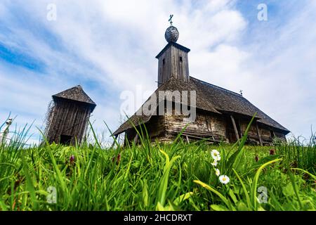 A wooden church built in 18th century in a small medieval village called Romanesti. Photo taken on 17th of April 2021 in Romanesti, Timis county, Roma Stock Photo