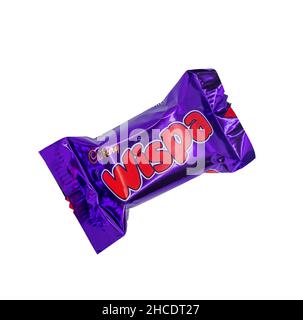 Norwich, Norfolk, UK – December 2021. Close up of a Cadbury Wispa chocolate bar cut out isolated on a plain white background. This is just one type of Stock Photo