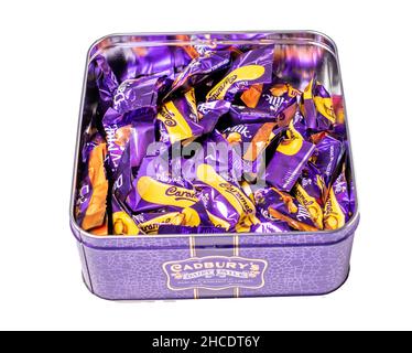 Norwich, Norfolk, UK – December 2021. Top down view of Cadbury chocolate bars, comprising Dairy Milk chocolate, Whole Nut and Caramel Stock Photo