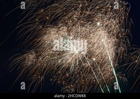 Closeup of fireworks exploding in the dark sky Stock Photo