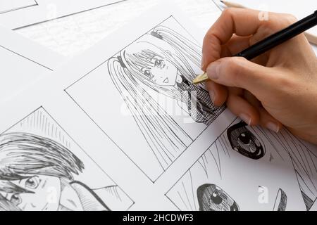 The Artist Draws Anime Comics On Paper Storyboard For The Cartoon The  Illustrator Creates Sketches For The Book Stock Photo - Download Image Now  - iStock