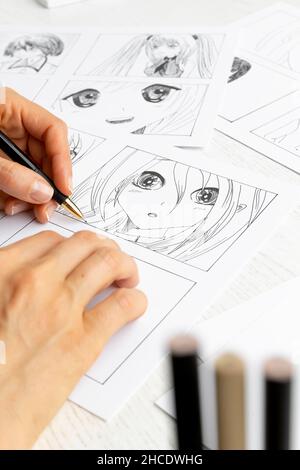 The Artist Draws Anime Comics On Paper Storyboard For The Cartoon The  Illustrator Creates Sketches For The Book Manga Style Stock Photo -  Download Image Now - iStock