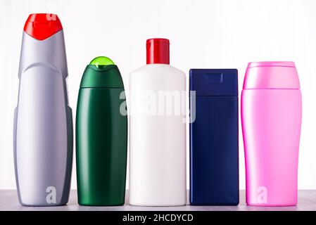 Multicolored bottles with hygiene products on table on white background Stock Photo