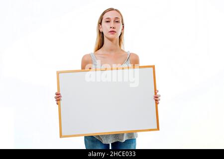 Young model holds a blank whiteboard ready for your text Stock Photo