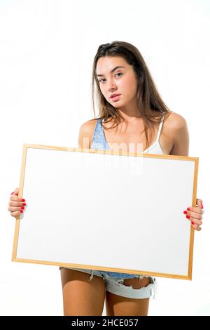 Young model hold a blank whiteboard ready for your text Stock Photo