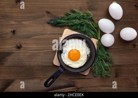 Fried chicken egg in a small frying pan with a stand Stock Photo