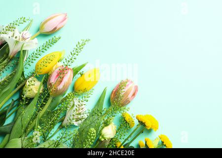 Hello spring concept with flowers on mint background Stock Photo