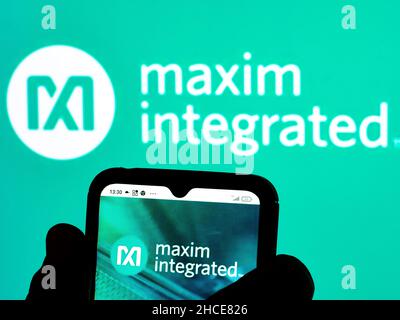 In this photo illustration the Maxim Integrated logo seen displayed on ...