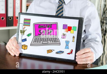 Online shop concept shown by a businessman Stock Photo