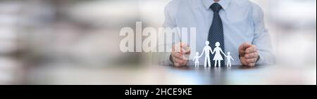 Insurer protecting a family with his hands; panoramic banner Stock Photo - Alamy