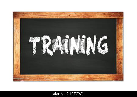 TRAINING text written on black wooden frame school blackboard. Stock Photo