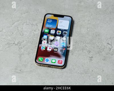 HCMC, Vietnam - August 19, 2021: View of new iPhone 13 or iPhone 13 Pro and Apple Airpods for editorial use Stock Photo