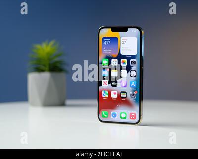 HCMC, Vietnam - August 19, 2021: View of new iPhone 13 or iPhone 13 Pro and Apple Airpods for editorial use Stock Photo