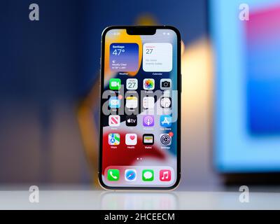 HCMC, Vietnam - August 19, 2021: View of new iPhone 13 or iPhone 13 Pro and Apple Airpods for editorial use Stock Photo