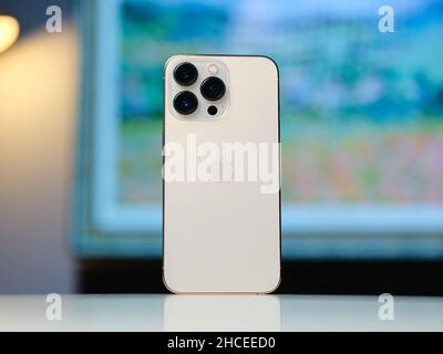 HCMC, Vietnam - August 19, 2021: View of new iPhone 13 or iPhone 13 Pro and Apple Airpods for editorial use Stock Photo