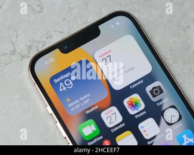 HCMC, Vietnam - August 19, 2021: View of new iPhone 13 or iPhone 13 Pro and Apple Airpods for editorial use Stock Photo