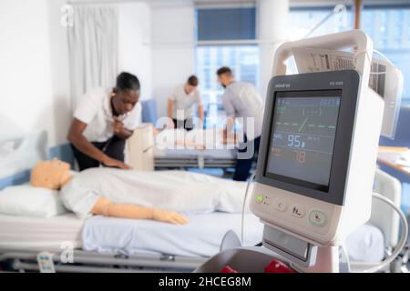 Student nurses training realistic medical dummy Stock Photo