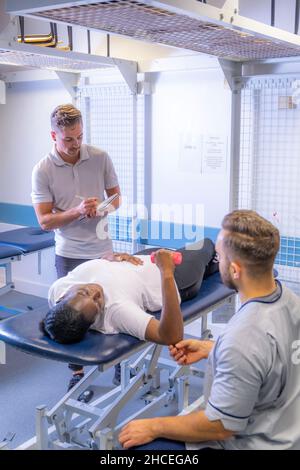Student nurses training realistic medical dummy Stock Photo