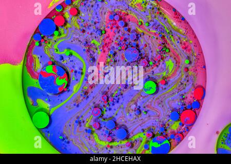 Oil mixed with paint form an abstract image. Stock Photo