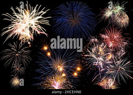 New year celebration fireworks against dark sky. Composition. Stock Photo