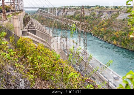 Hydroelectric power station along a deep narrow gorge on a cloudy autumn day