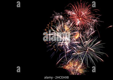 New year celebration fireworks against night sky. Copy space. Stock Photo