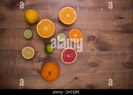 Top view shot of slice's of citrus on a wooden surface Stock Photo