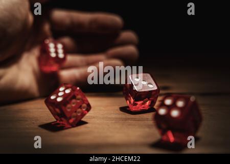 hand rolling dice. risk, luck and gambling concept Stock Photo