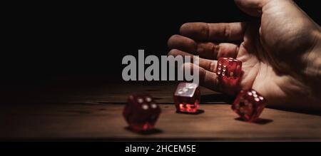 dice roll. hand throwing game cubes. concept of risk and gamble. copy space Stock Photo