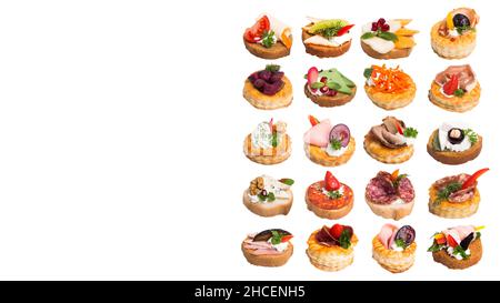 Canapes with different berries and toppings isolated on a white background Stock Photo