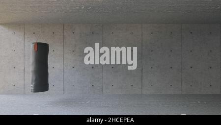Boxing bag hangs in front of a gray concrete wall background in the fitness center Stock Photo