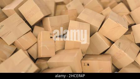 Pile of brown cardboard boxes background header, logistics and delivery concept image Stock Photo