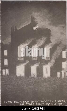 Photographic postcard showing Luton Town Hall in flames during the 1919 Peace Day riots. The civic building was set on fire by ex-servicemen unhappy at their post-war treatment Stock Photo