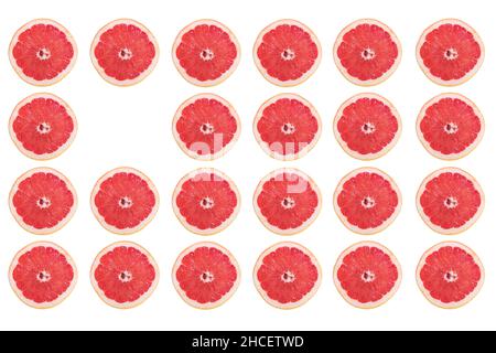Rows of grapefruit slices and only one missing isolated on a white background Stock Photo