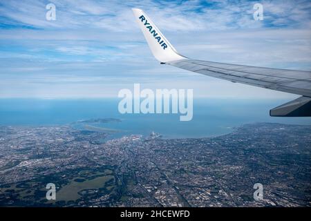 View over Dublin city and the Irish sea from a Ryanair flight shortly after take off, Dublin, Ireland Stock Photo