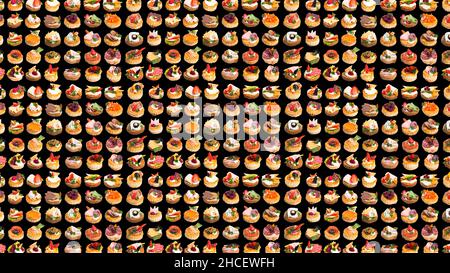 Canapes with different berries and toppings isolated on a black background Stock Photo