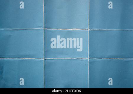 Blue paper folded in nine fraction background Stock Photo