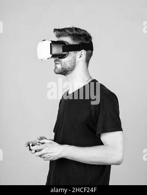 Testing new technologies. man with glasses of virtual reality. Future technology. guy getting experience using VR-headset glasses. man in virtual Stock Photo