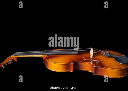 Violin isolated on black background with place for text. Close up. Stock Photo