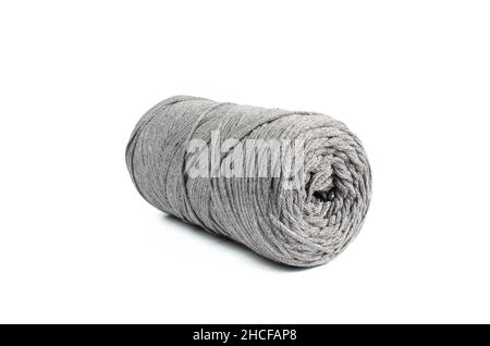 Roll of grey thread for knitting isolated on white background. Macrame Stock Photo