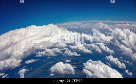 Curvature Of Planet Earth. Aerial Shot. Blue Sky And Clouds Over Island 