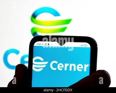 Ukraine. 28th Dec, 2021. In this photo illustration Cerner Corporation logo seen displayed on a smartphone and in the background. (Photo by Igor Golovniov/SOPA Images/Sipa USA) Credit: Sipa USA/Alamy Live News Stock Photo