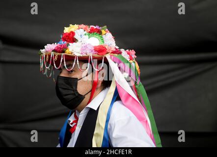 Malaga, Spain. 28th Dec, 2021. A participant dressed in a traditional costume seen during the festival. The 59th edition of Verdiales Flamenco Dance contest, an important cultural and music festival from rural origin, its celebrated annually on Fools Saints Day. Musicians from different musical groups known as 'pandas' compete in a contest singing and dancing style of flamenco music called 'Verdiales' using musical instruments typical of the Andalusian popular folklore. (Photo by Jesus Merida/SOPA Images/Sipa USA) Credit: Sipa USA/Alamy Live News Stock Photo