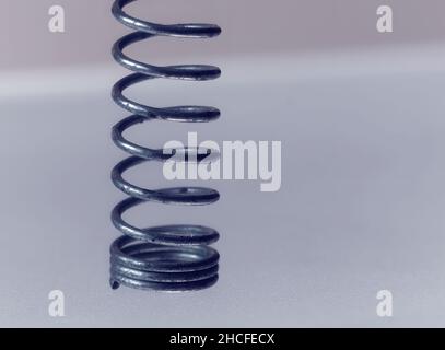 Close-up picture of a rusty gold and silver screw on a white background Stock Photo