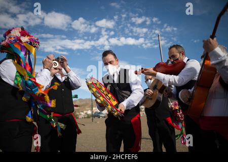 Malaga, Spain. 28th Dec, 2021. Participants dressed in traditional costumes rehearsing before, during the festival. The 59th edition of Verdiales Flamenco Dance contest, an important cultural and music festival from rural origin, its celebrated annually on Fools Saints Day. Musicians from different musical groups known as 'pandas' compete in a contest singing and dancing style of flamenco music called 'Verdiales' using musical instruments typical of the Andalusian popular folklore. Credit: SOPA Images Limited/Alamy Live News Stock Photo