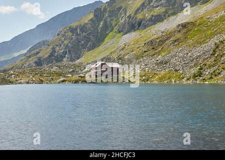 Hut in the mountains with a beautiful mountain lake in Mallnitz, Austria Stock Photo