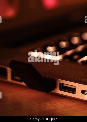 Close up of USB dongle connected to computer laptop Stock Photo